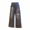 Product shot of Grey 90 Sweatpants with SMALL AND RARE insignia on the top right thigh and "90" patch on the left mid-thigh.