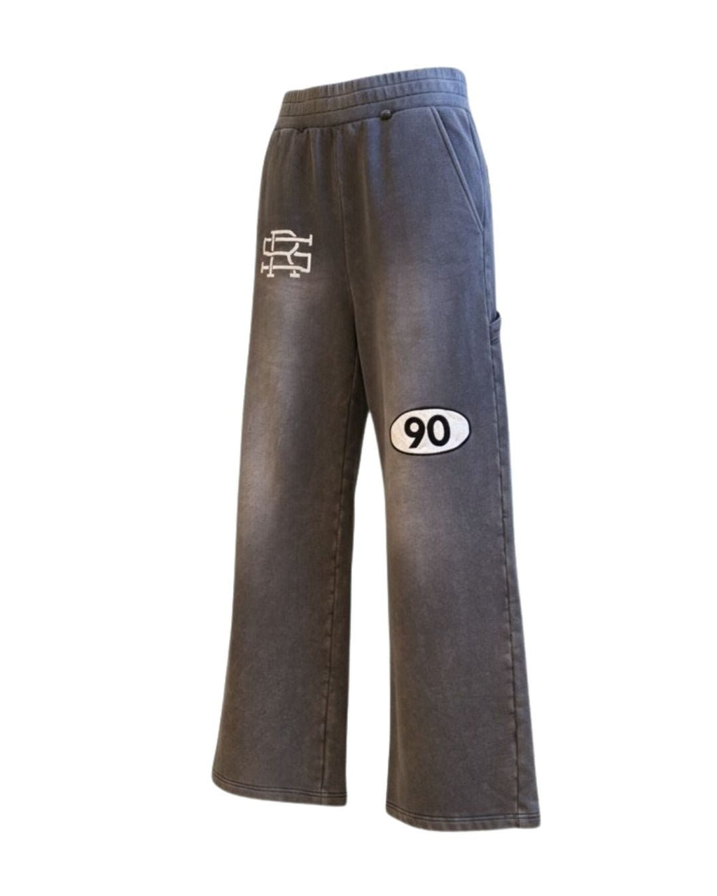 Product shot of Grey 90 Sweatpants with SMALL AND RARE insignia on the top right thigh and "90" patch on the left mid-thigh from the side left angle.