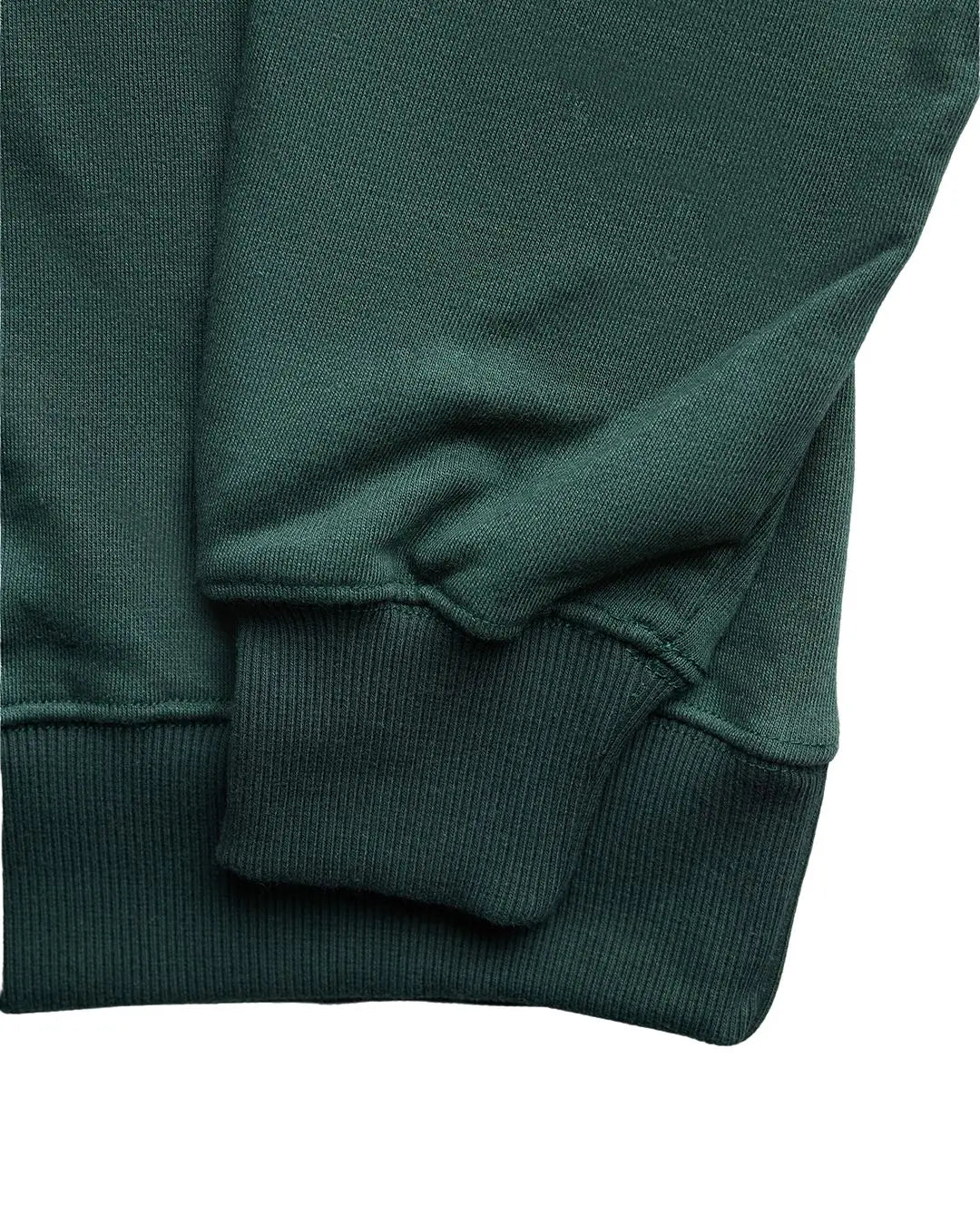 Close-up of the Green Core Crewneck Sweatshirt's ribbed neckline and subtle stitching detail from a lower angle.