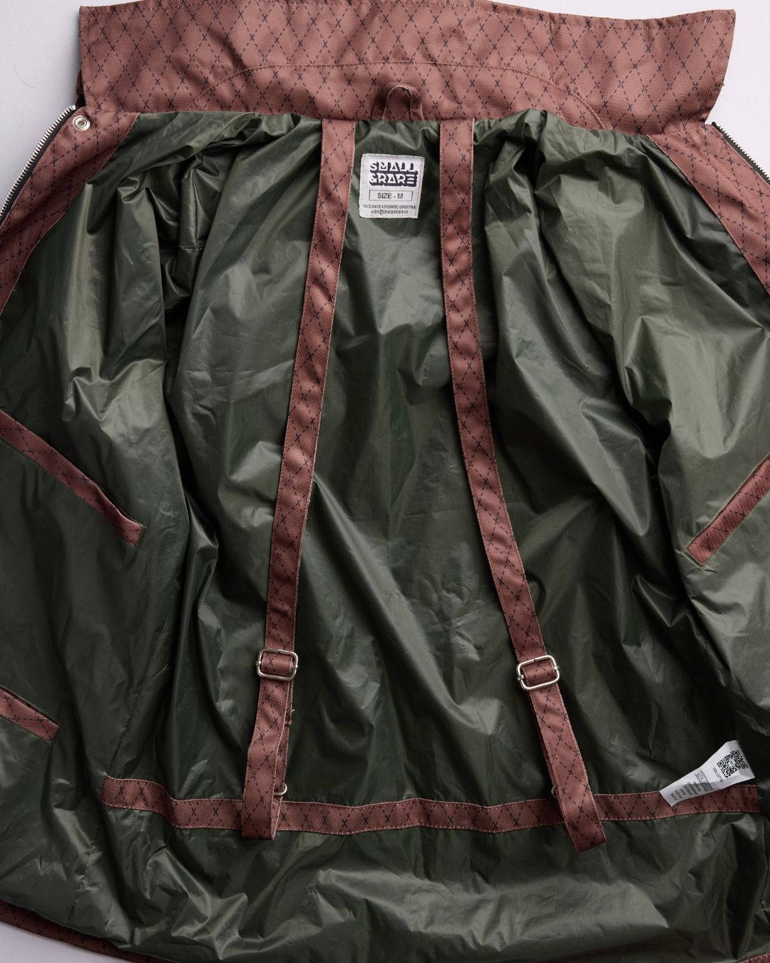 Close-up of the Versa Workwear Jacket's black durable cotton blend fabric highlighting subtle weave texture and reinforced