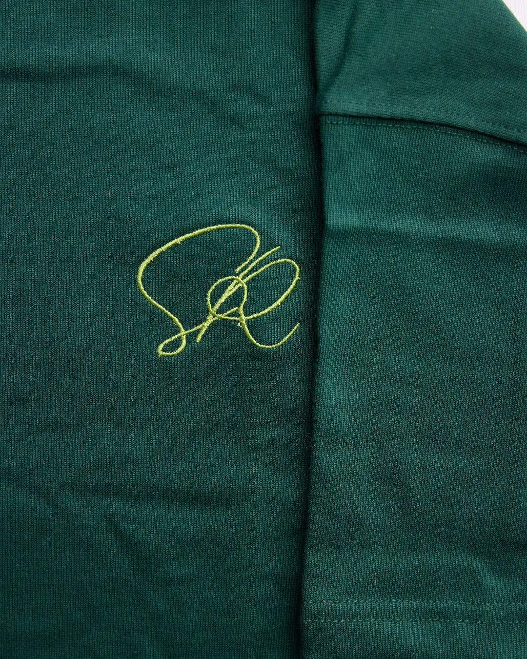 Close-up of the Green Core Streetwear Tee's relaxed fit, highlighting the soft cotton fabric and vibrant forest green color