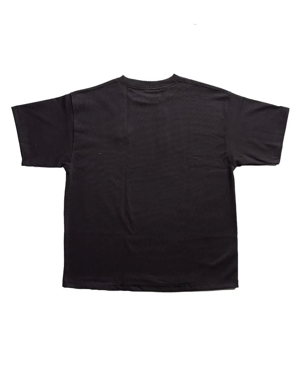 Close-up of the black cotton jersey fabric showing subtle stitching details and relaxed fit sleeve edge from a front