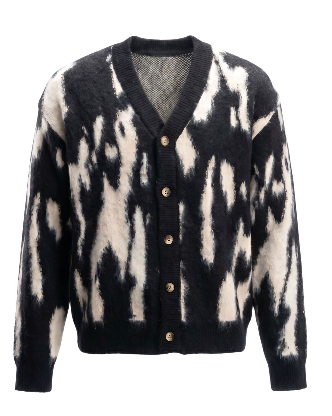 Product shot of J cardigan with Black and white pattern with button details on a white background.