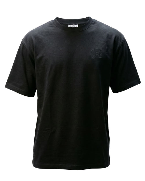 Product shot of Black Core Street Wear shirt featuring black embroidered insignia on left chest.