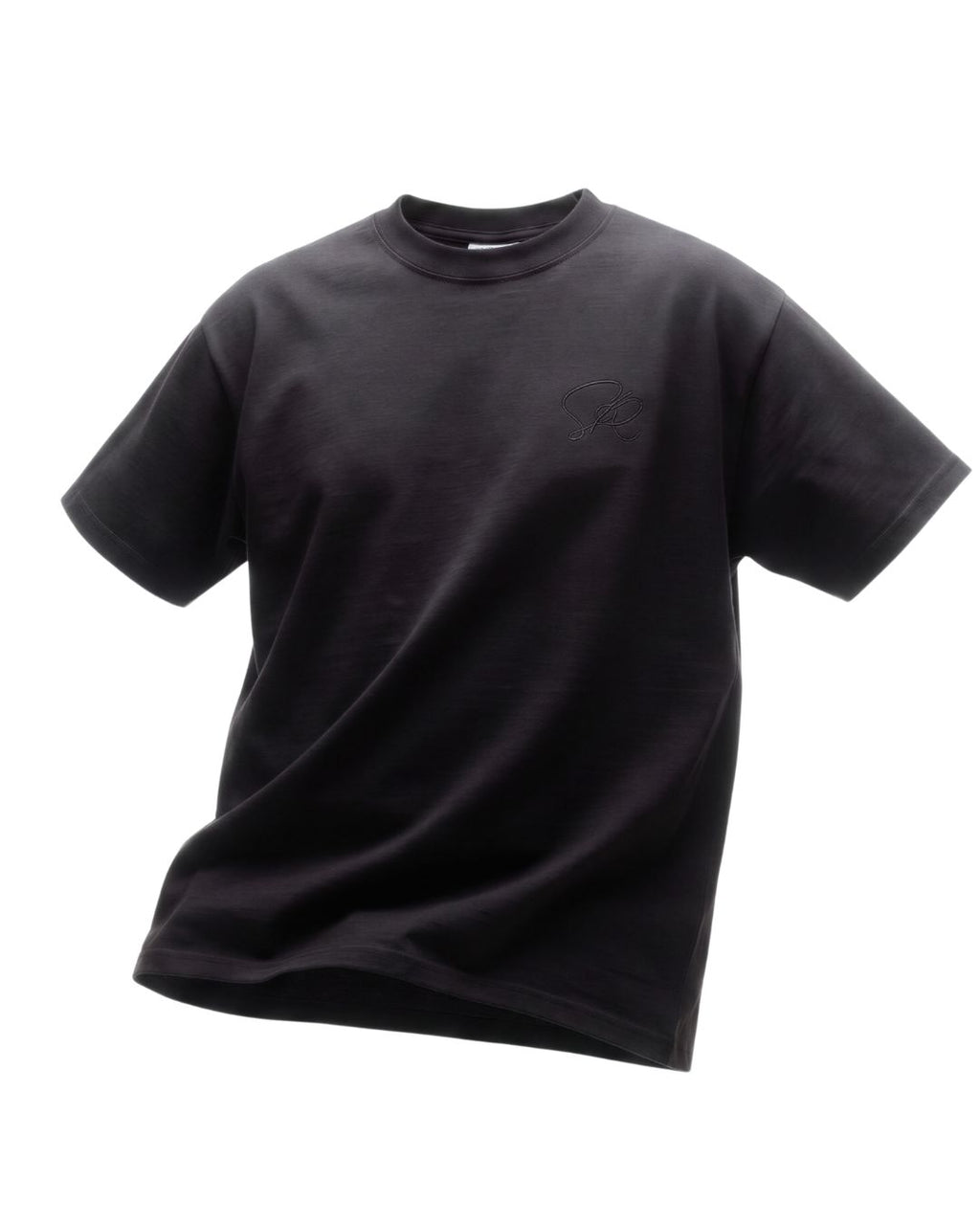 Product shot of Black Core Street Wear shirt featuring black embroidered insignia showing movement.