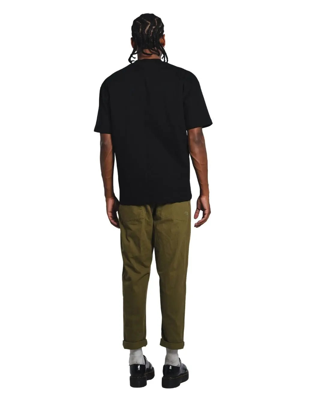 Product shot of Black Core Street Wear shirt on male model facing the back. 