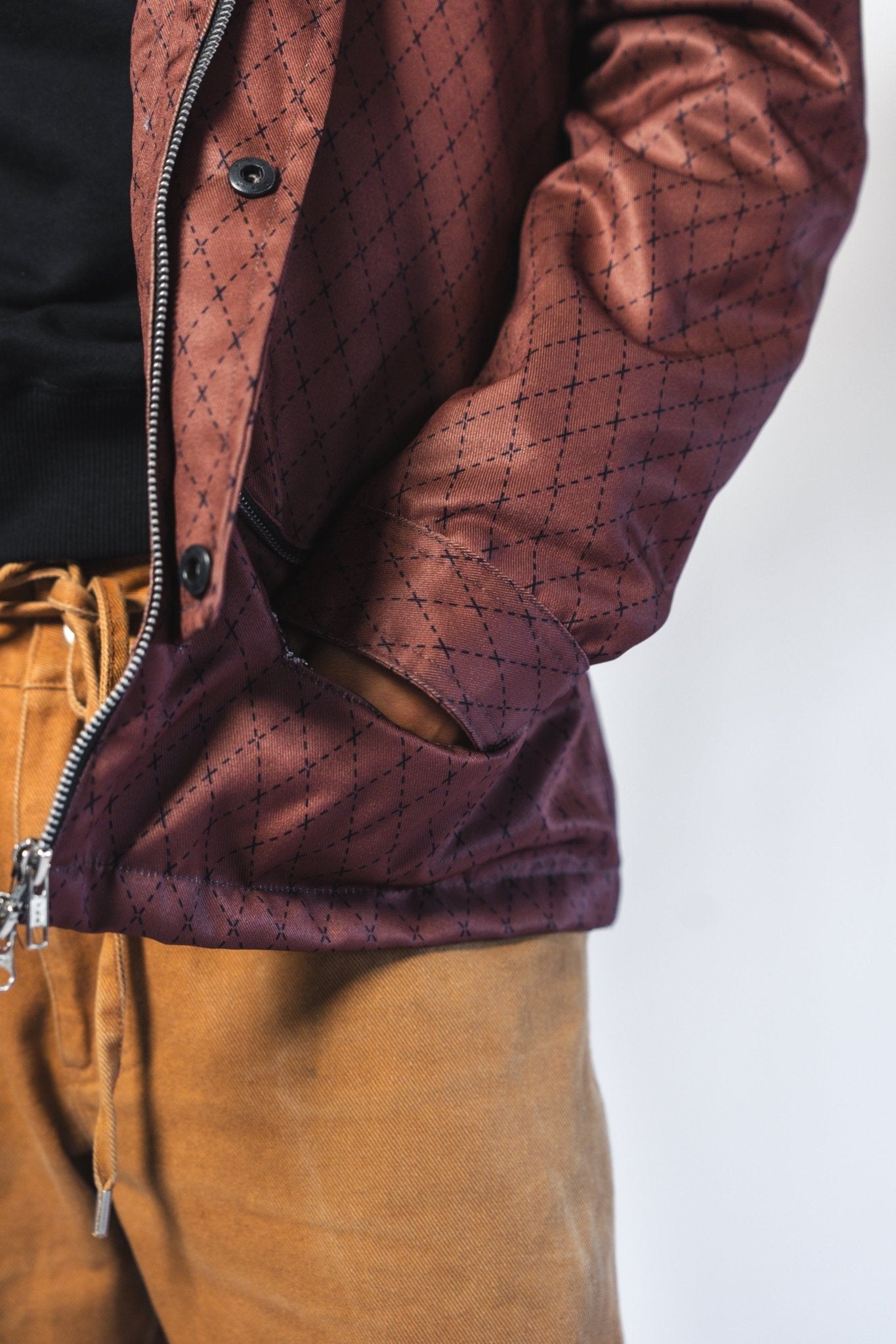 Close-up of the Versa Workwear Jacket's adjustable sleeve cuff with reinforced stitching in navy cotton blend fabric.