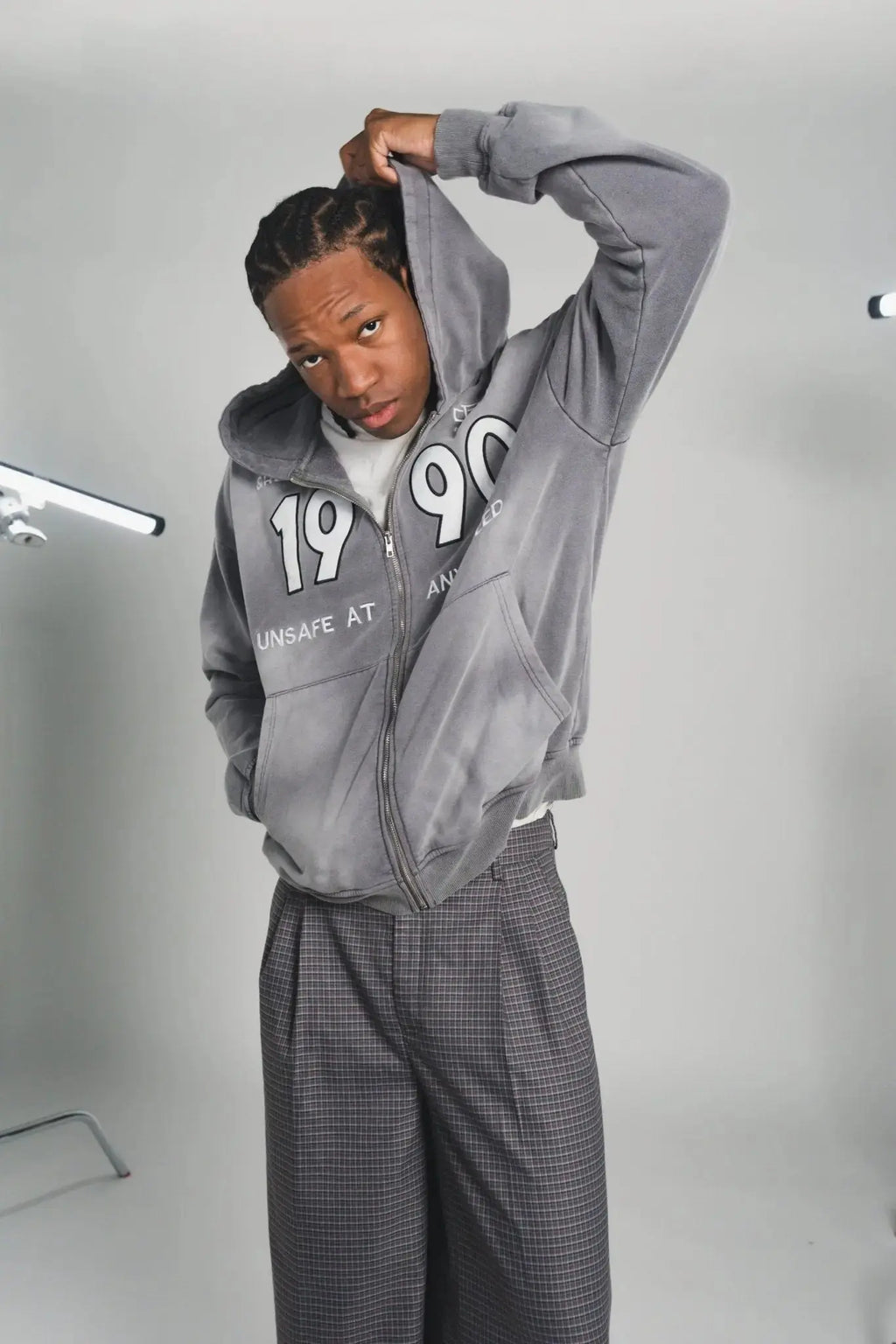 Close-up of the Grey90 Zip Hoodie’s front quarter with visible ribbed cuffs and subtle fabric texture in relaxed fit fabric.