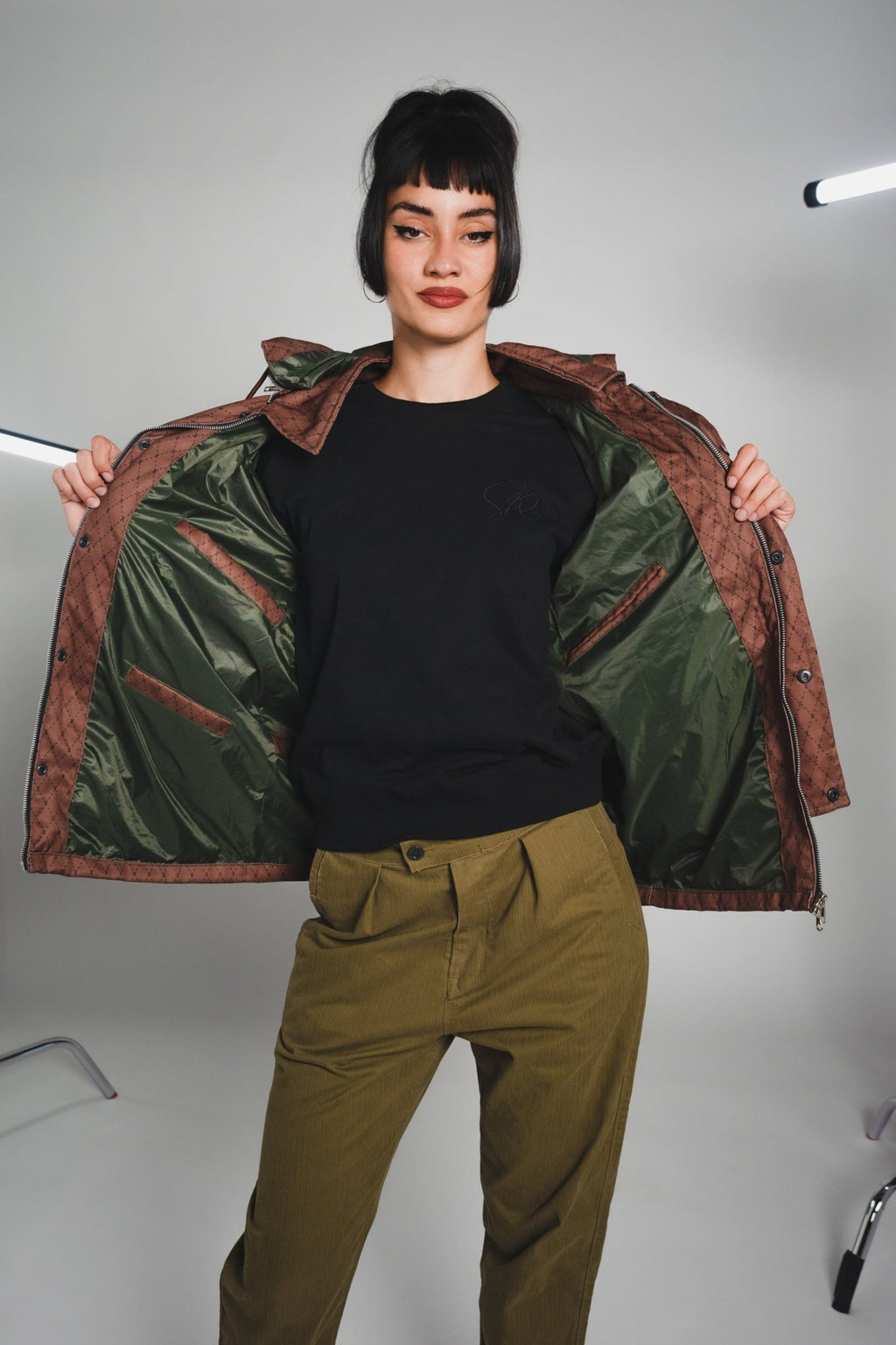 Close-up of the Versa Workwear Jacket's navy ripstop fabric displaying reinforced stitching and durable sleeve cuff details.