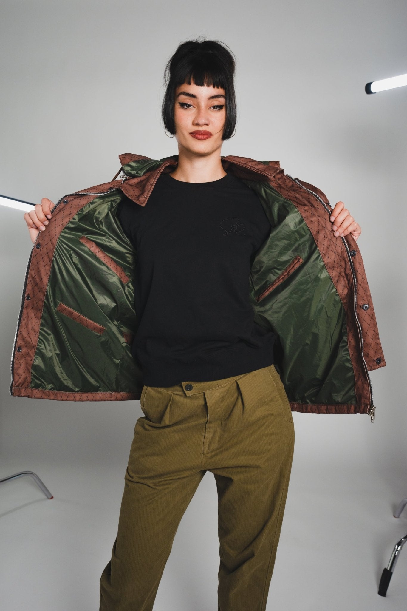 Close-up of the Versa Workwear Jacket's navy ripstop fabric displaying reinforced stitching and durable sleeve cuff details.