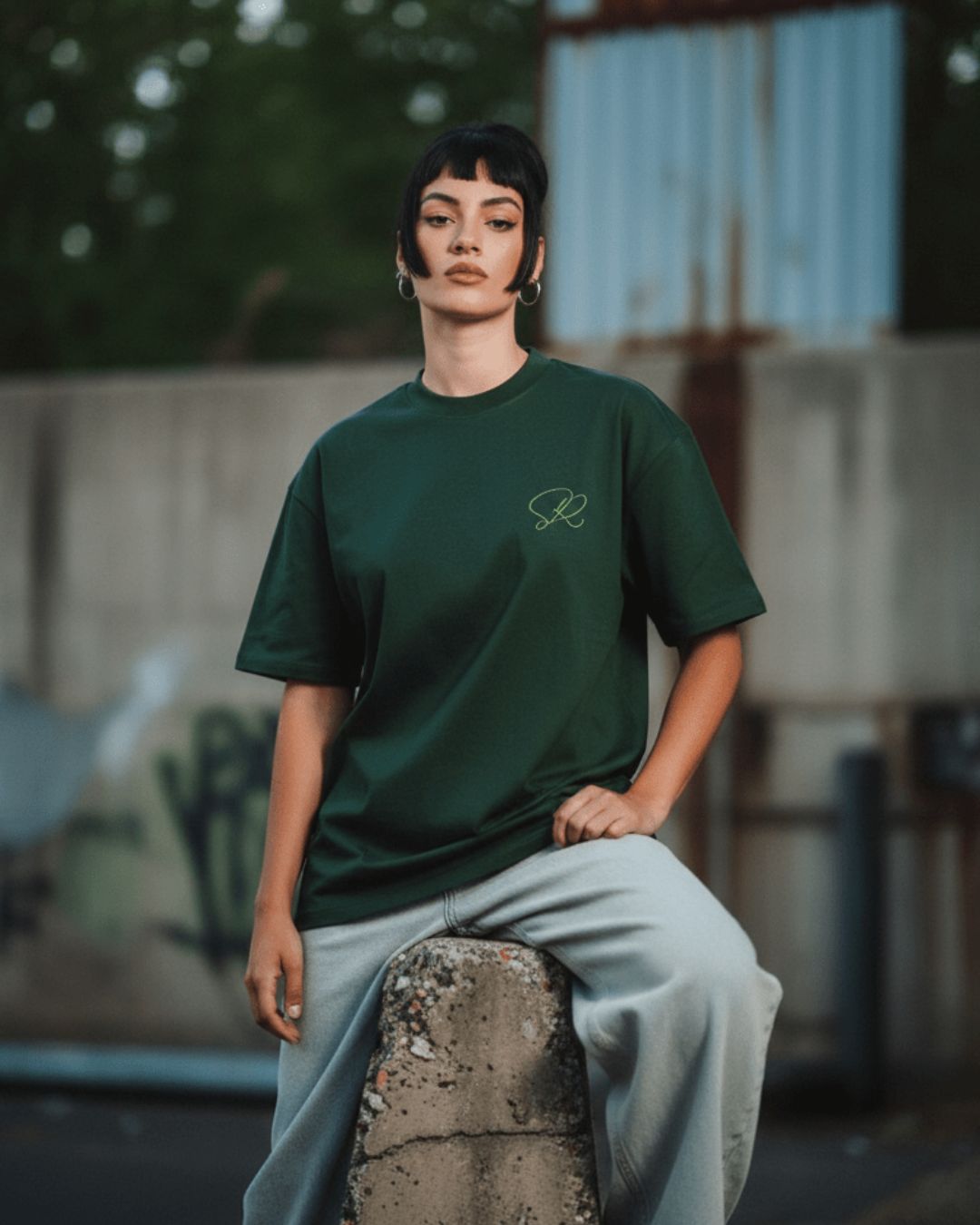 Close-up of the Green Core Streetwear Tee's crew neckline with visible stitching and fabric texture in vibrant Kelly green