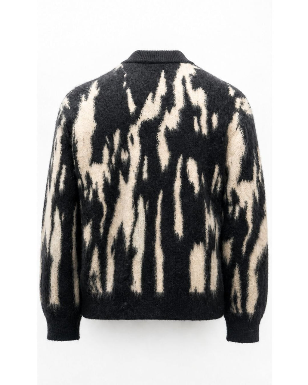 Product shot of J cardigan with abstract black and white pattern on a white background.