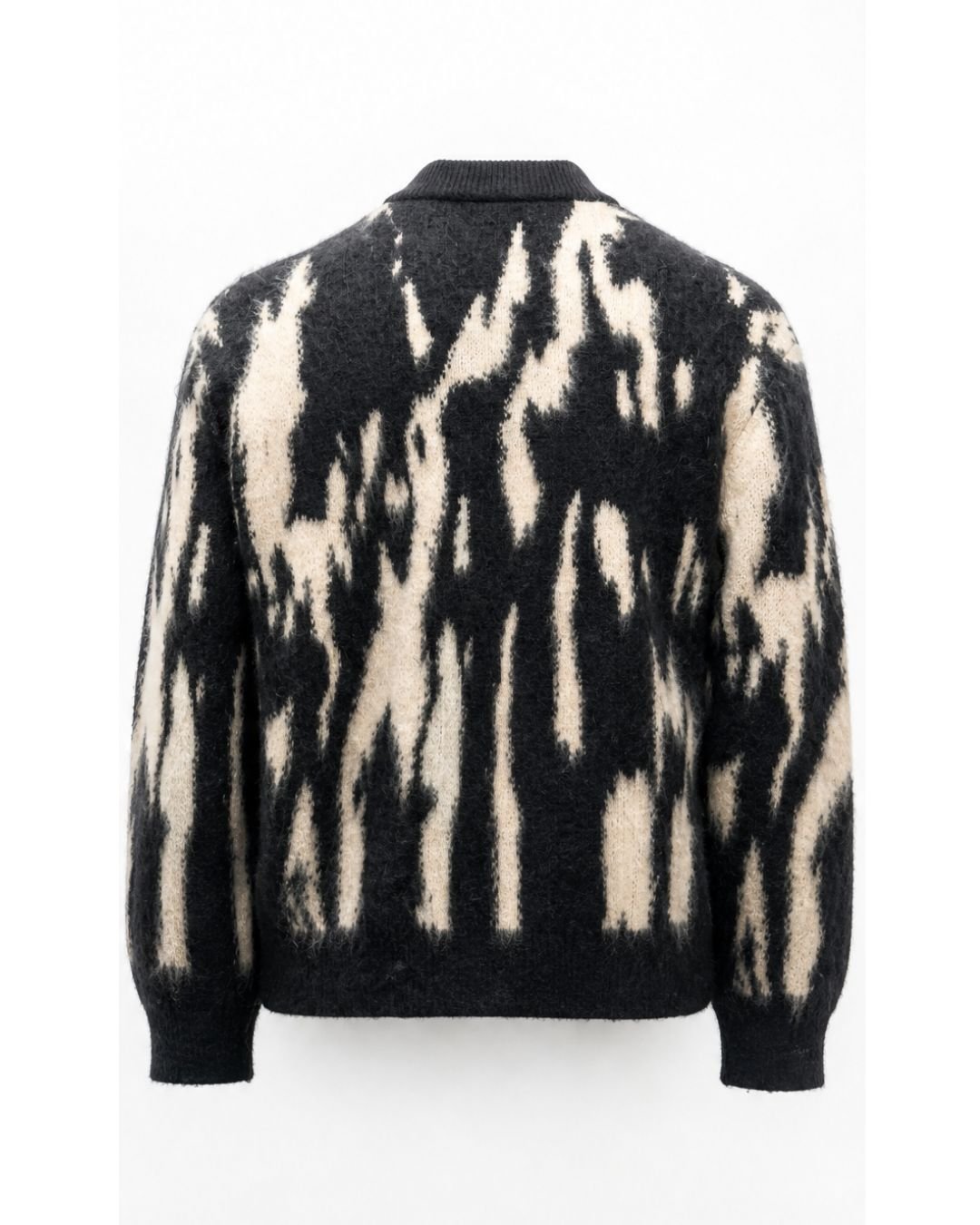 Product shot of J cardigan with abstract black and white pattern on a white background.